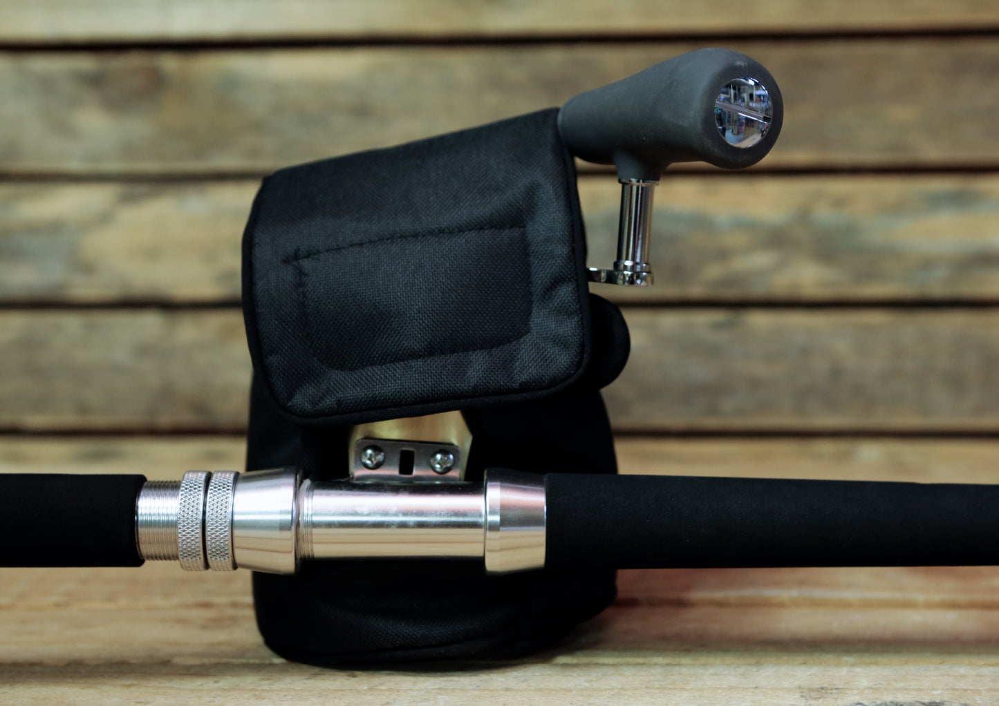 Protective cover for multiplier reels